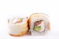 Japanese Cuisine, Sushi Set: roll with eel, salmon, cream cheese, avocado, teriyaki sauce, sesame on a white background. Royalty Free Stock Photo