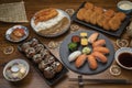 Japanese cuisine Sushi set, salmon, conger and tuna sushi with curry rice with fried shrimp and Takoyaki on wooden table. Royalty Free Stock Photo