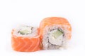 Japanese Cuisine, Sushi Set: salmon roll with cheese and cucumber on a white background. Royalty Free Stock Photo