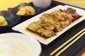 Japanese cuisine, Teriyaki chicken served with rice, miso soup, Chawanmushi and salad on wooden table Royalty Free Stock Photo