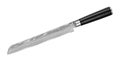 Japanese Damascus steel bread knife with serrated blade on white background. Kitchen knife isolated with clipping path. Top view Royalty Free Stock Photo