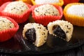 Japanese dessert mochi daifuku with anko and sesame close-up. Horizontal Royalty Free Stock Photo