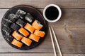 Sushi rolls set with sauce and chopsticks Royalty Free Stock Photo