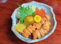 Japanese dining uni bowl with ikura and egg