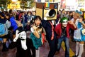 Japanese dressed in Halloween costumes pose for a group picture at Shibuya Hackiko Square in 2014.
