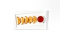 Japanese dumplings gyoza with sauce on white plate. Fried chinese dumplings isolated on white background Asian appetizer - fried Royalty Free Stock Photo