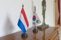 Japanese and Dutch flags on the table. object photography style