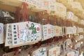 Japanese Ema or small wooden votive plaques hanging up at a shrine