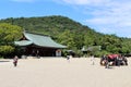 Japanese family taking photos in front of Kashihara Jingu Temple in Nara