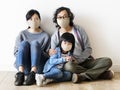 Japanese family wearing face masks inside the house