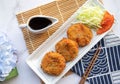 Korokke - Japanese appetizer of deep fried mashed potatoes, crab sticks and vegetables wrapped with bread crumbs at top view