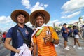 Japanese fans of football smiling two people before football match