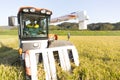 Harvest rice with a combine Royalty Free Stock Photo