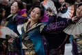 Elegant Japanese female dancers in kimono with colorful fans