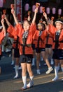 Japanese festival dancers in orange happi kimono Royalty Free Stock Photo