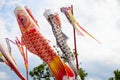 Japanese fish kite on sky background. Koi or koinobori kite in air. Traditional oriental festival decor Royalty Free Stock Photo