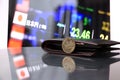 Japanese five hundred Yen coins on obverse JPY on reflex floor with black wallet and digital board of currency exchange money. Royalty Free Stock Photo