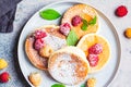 Japanese fluffy pancakes with raspberries in gray plate, gray background, top view. Japanese cuisine concept