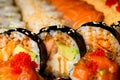 Japanese food banner: set of different rolls on blurred background Royalty Free Stock Photo