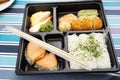 Japanese food bento box rice and fried salmon and vegetables with other cuisine on table Royalty Free Stock Photo