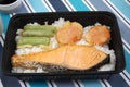 Japanese food bento box rice and fried salmon and vegetables with other cuisine on table Royalty Free Stock Photo