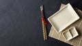 Japanese food concept. Chopsticks and empty sushi plate on bamboo mat. Royalty Free Stock Photo