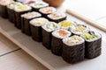 Japanese food mini maki sushi platter on white wooden table Royalty Free Stock Photo