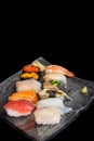 Mixed sushi set isolated on black background Royalty Free Stock Photo