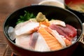 Japanese food with raw fishes, called sashimi on the rice in Bow Royalty Free Stock Photo