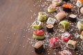 Set of sushi, maki and rolls with sesame on wooden rustic background Royalty Free Stock Photo