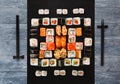 Set of sushi, maki and rolls on blue wood background Royalty Free Stock Photo