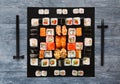 Set of sushi, maki and rolls on blue wood background Royalty Free Stock Photo