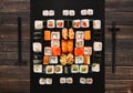 Set of sushi, maki and rolls on brown wood background Royalty Free Stock Photo