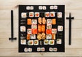 Set of sushi, maki and rolls on natural wood background Royalty Free Stock Photo