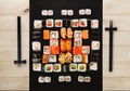 Set of sushi, maki and rolls on natural wood background Royalty Free Stock Photo