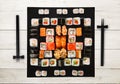 Set of sushi, maki and rolls on white wood background Royalty Free Stock Photo
