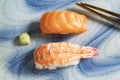 Japanese food salmon and prawn sushi on plate has chopstick