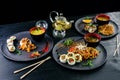 Japanese food served table large set of sushi rolls and noodles Royalty Free Stock Photo