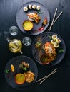 Japanese food served table large set of sushi rolls and noodles Royalty Free Stock Photo