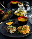 Japanese food served table large set of sushi rolls and noodles Royalty Free Stock Photo