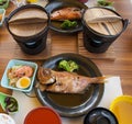 Japanese food set of Purple-Spotted Bigeye fish steam in soy sauce.