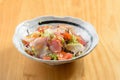 japanese food style fresh Kaisen Salad salmon sashimi slices in a bowl with raw fish on wooden background top view Royalty Free Stock Photo