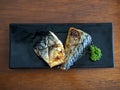 Japanese food style , grilled Saba fish in dish on wood table, Top view Royalty Free Stock Photo