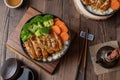 Japanese Food Style : Top view of Homemade Chicken Teriyaki grilled with rice , carrot , broccoli put on the black bowl and place Royalty Free Stock Photo