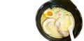 Japanese food style, Top view of ramen with Pork, egg, miso based soup, spoon in black bowl. Royalty Free Stock Photo