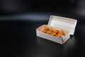 Japanese food, sushi roll cardboard box for fast food. White paper food box. Cardboard products. delivery box. Copy space. Black