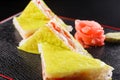 Triangular pieces. Japanese food, tasty of meal for lunch. Seafood. Sushi with eel, salmon, trout, tuna black background