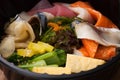 Japanese food Tekka Don take away on wooden background Royalty Free Stock Photo