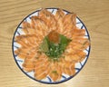 Japanese food: thinly sliced salmon sashimi fresh raw salmon meat decorated with grated turnip, lime, chopped spring onion Royalty Free Stock Photo