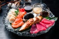 japanese foods sashimi. Mixed sliced fish sashimi in dark background Royalty Free Stock Photo